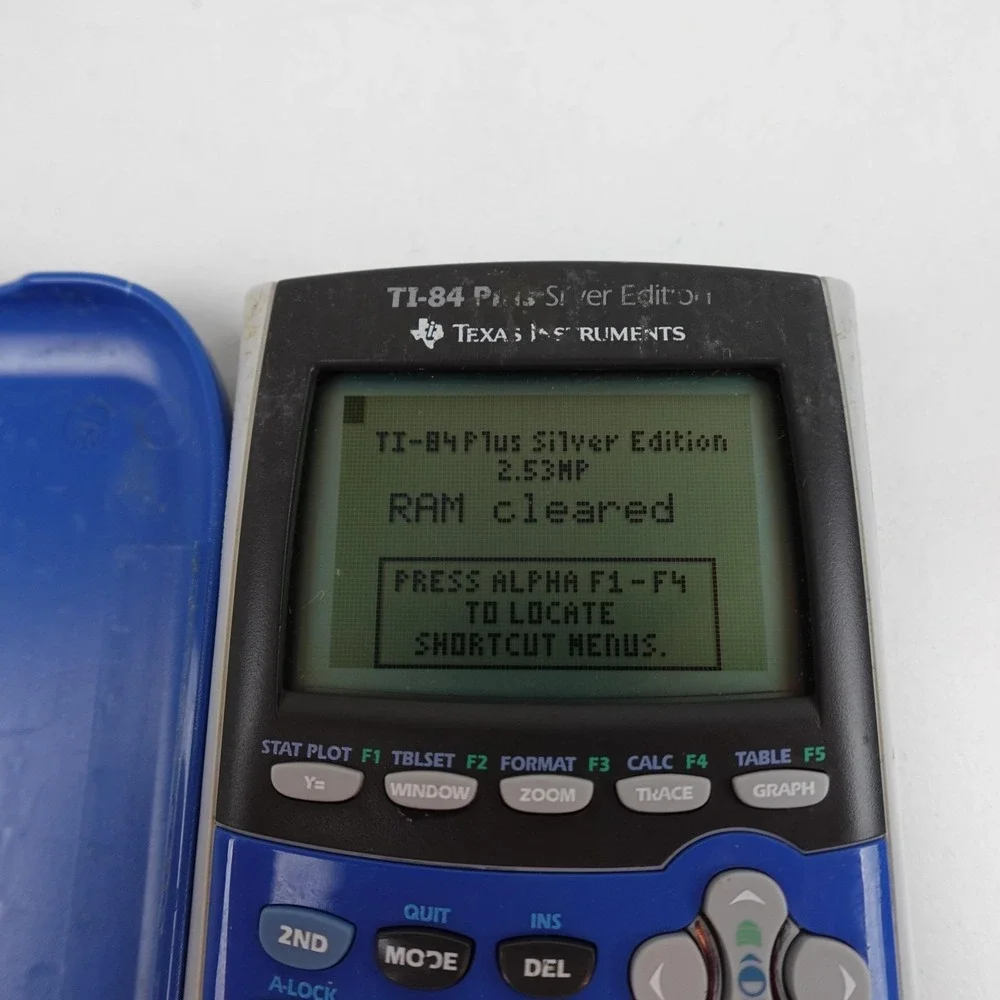 Texas Instruments TI-84 Plus Silver Edition Blue Graphing Calculator Tested